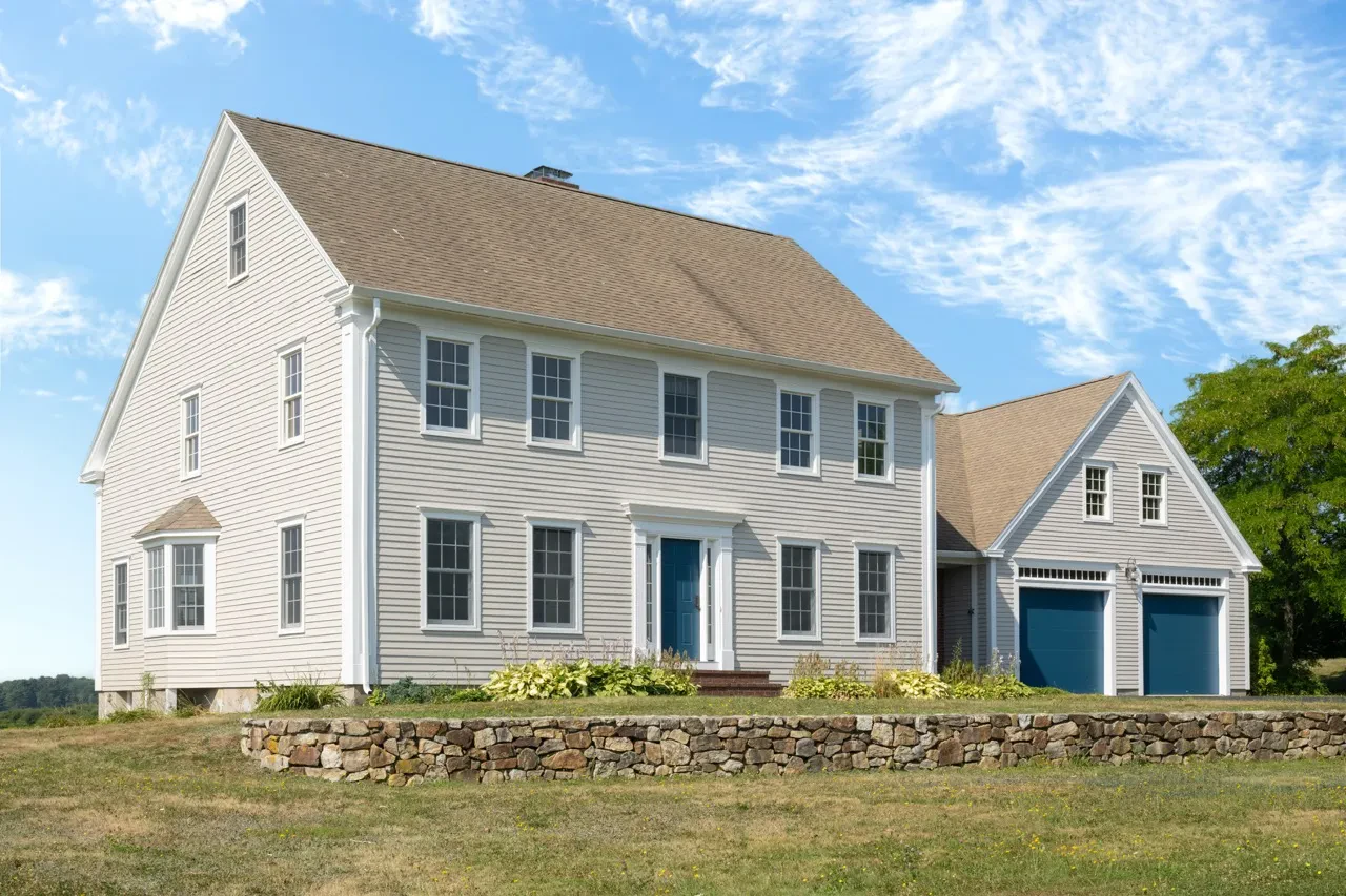 The outside of a Maine home after being painted by Innovation Painting & Remodeling.